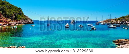 Panorama Of Sailboats At Cala Salada Lagoon. Idyllic Scenery. Ibiza, Balearic Islands. Spain