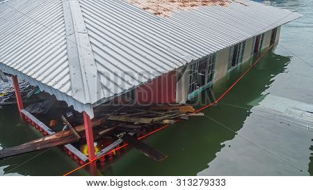 Labuan,malaysia-july 24,2019:a Floating House Was Sinking & Covered By Water In A Recent Disaster In