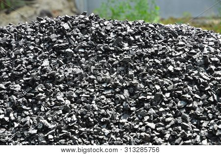 A Pile Of Coal Anthracite Fines Glitters In The Sun.