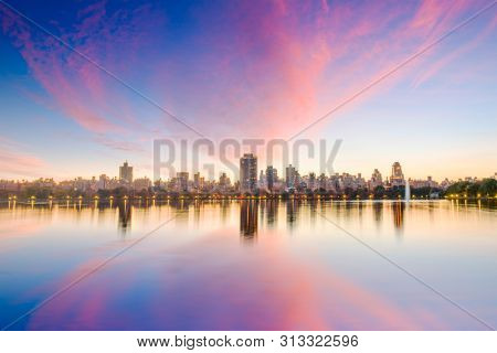 New York, New York, USA at Central Park and reservoir in autumn season. 