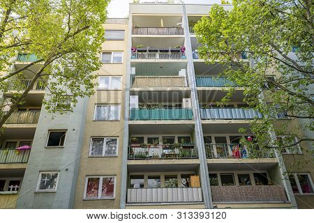 Poor Berlin House With Balconies And Trees