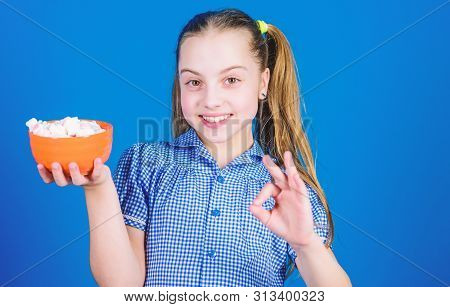 Delicious Marshmallow. Candy Shop. Small Girl Eat Delicious Marshmallow. Healthy Food And Dental Car