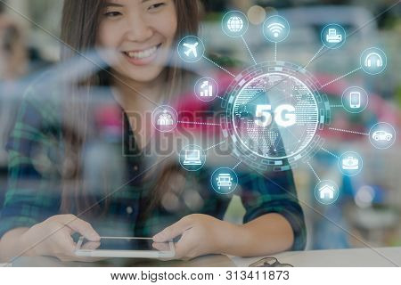 5g Technology With Various Icon Internet Of Thing Over Hand Using The Smart Mobile Phone On The Desk