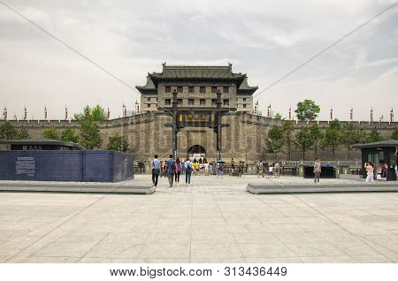August 15, 2019.  Xian, China. People At Yongning Men In Traditional Chinese Characters Over The Sou