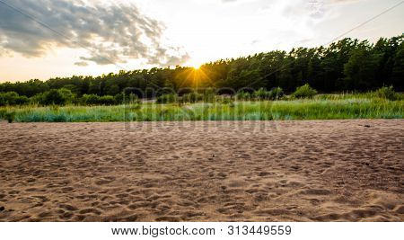 Sandy Beach And Sunset At The Bay
