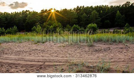 Sandy Beach And Sunset At The Bay