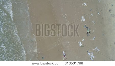 Trash, Plastic, Garbage, Bottle... Environmental Pollution On The Beach. Royalty High-quality Free S