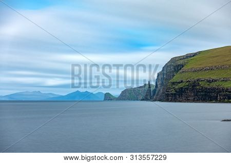 Sandoy Rock Needle In The Steep Coastline, Long Exposure