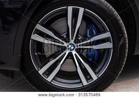 Novosibirsk, Russia - 07.20.2019: Black New Bmw X7 Xdrive40i 2019 Year Front Wheel And Blue Disk Vie