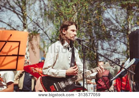 Russia, Siberia, Novokuznetsk - May 9, 2019: Musicians Sing Songs On The Street On Victory Day