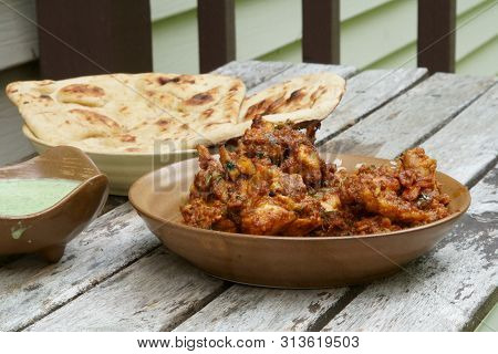 Veiw Of  Homemade Tava Chicken With Green Raita Chutney And Tandoori Roti