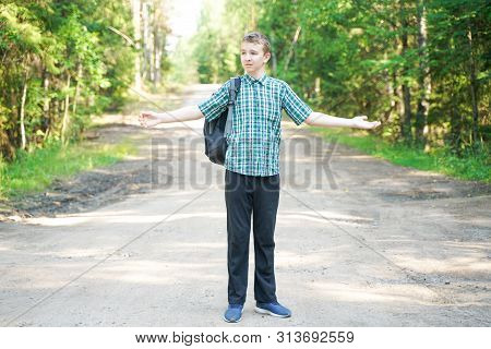 Teenager Boy Walking In The Forest Alone In The Summer Day