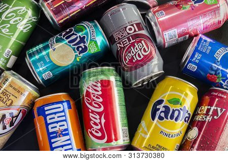 Omsk, Russia - July 14, 2019: Close-up Soda. Different Manufacturers. Coca Cola, Fanta, 7up, Iron Br