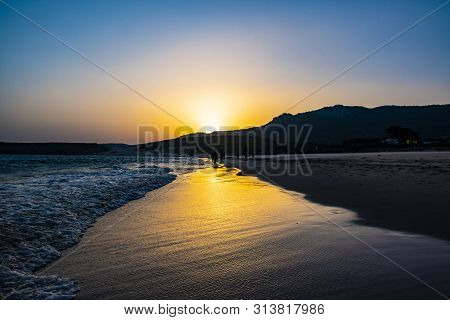 Sunset In Bolonia In The Beach With The Sea