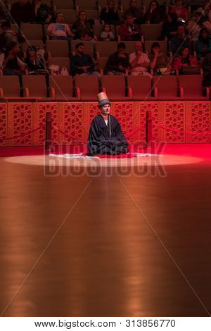 Konya, Turkey - October 21, 2018: Semazen or Whirling Dervishes at Mevlana Culture Center in Konya, Turkey. Beginning of the ceremony