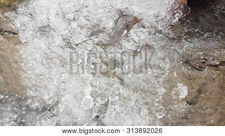 Abstract Icy Texture Background. Marbled Iced Texture. Frozen Water Flows And Drops. All Grey Winter