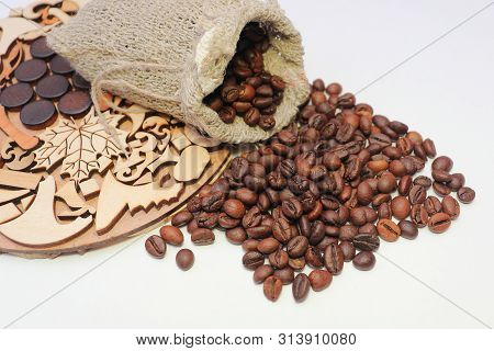 Coffee Beans. Roasted Coffee Beans In A Coarse Woven Bag.