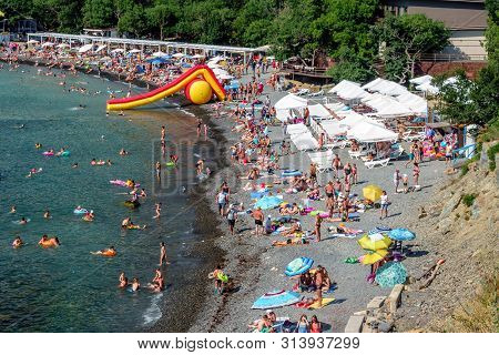 Anapa, Russia - July 12, 2019: Stony Beach Of Black Sea Coast In Bolshoy Utrish Village Full Of Peop