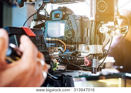 Film Industry. Cameraman Shooting Film Scene With Camera