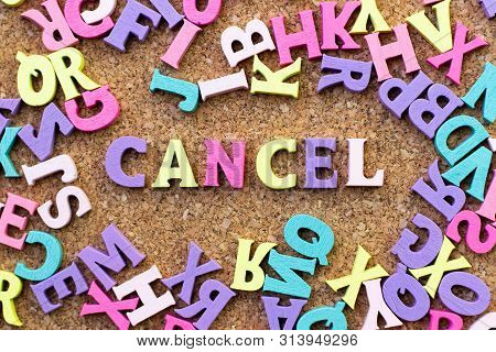 Color Alphabet In Word Cancel With Another Letter As Frame On Cork Board Background