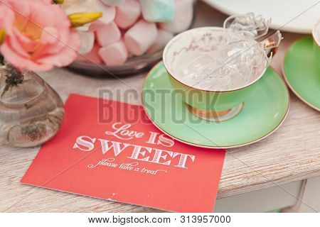A Picnic Table With Dishes, Wine Glasses, Candleholders And Various Snacks, Swomens Day, Wedding, Ce