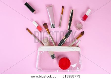 Makeup Professional Cosmetics On Pink Background. Top View With Copy Space.