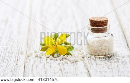 Homeopathic helidonium globules with helidonium majus flower