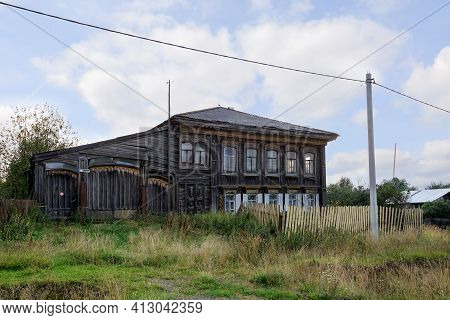 Village Street In Summer. Old Carved Wooden House. Ancient Village Of Visim, Sverdlovsk Region, Ural