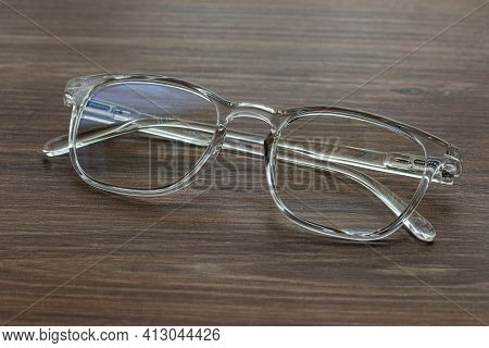 Glasses For Vision With Dioptria On The Wooden Table Office