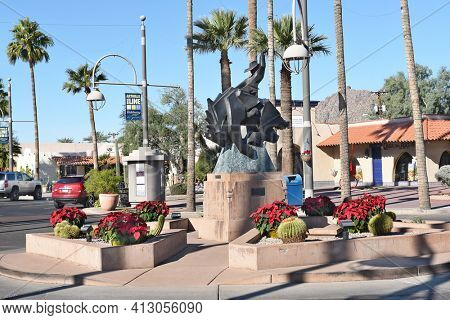SCOTTSDALE, ARIZONA - DECEMBER 9, 2016: Jack Knife sculpture on Main Street. The bronze statue, by Ed Mell, of a rider on a bucking horse was inspired by the city's official seal.