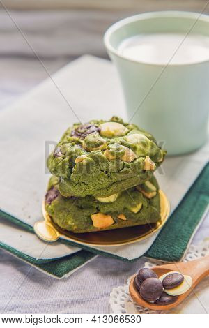 Stack Of Homemade Greentea Cookies On A Table With A Cup Of Milk Background