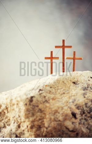 Three Wooden Cross On Calvary Hill, Grey Background. Crucifixion, Resurrection Of Jesus Christ. Chri