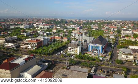 Kuta, Bali, Indonesia, March 15, 2021. Aerial Drone View Of Kuta City. Flying Over Bali Villas In Ku