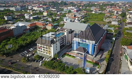 Kuta, Bali, Indonesia, March 15, 2021. Aerial Drone View Of Kuta City. Flying Over Bali Villas In Ku