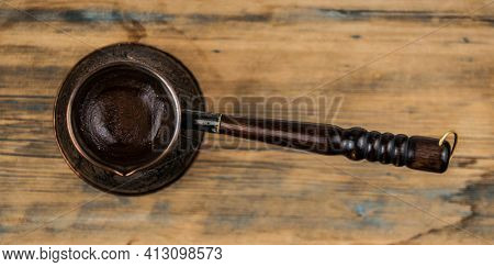 Making black coffee in cezva for the breakfast at the early morning. Top view