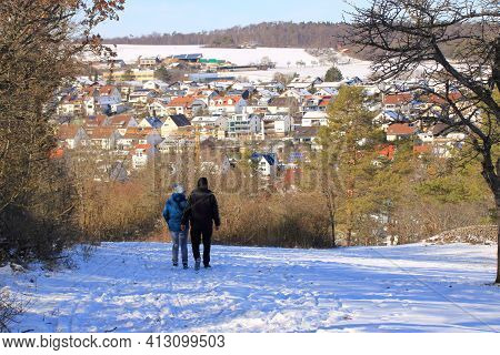 Two Hikers Hike Towards Weissach Im Heckengäu In Winter