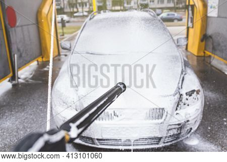 Contactless  Car Wash Self Service System. Washing Dirty Car In Car Wash Station With Foam