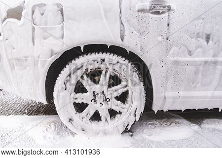 Car Covered With Washing Foam At Contactless Car Washing Service