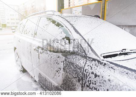 Car Covered With Washing Foam At Contactless Car Washing Service