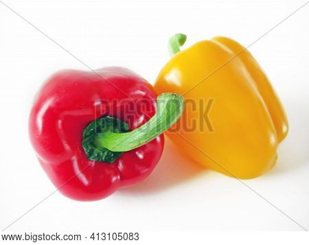 Red And Yellow Sweet Peppers On White Background, Bellpeppers, Paprika, Closeup
