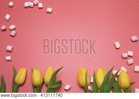 Yellow Tulips And Marshmallows On The Pink Background, With Free Space For Text.