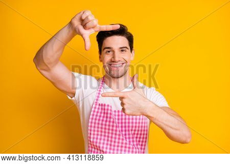 Photo Of Cheerful Young Man Arms Fingers Make Cadre Gesture Toothy Smile Isolated On Yellow Color Ba