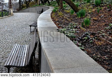 The Retaining Wall At The Large Staircase In The Park Is A Flowerbed Area Planted With Rich Greenery