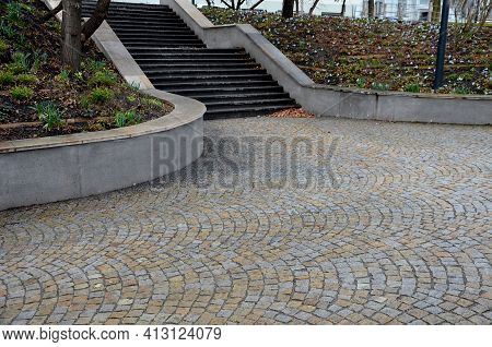 Retaining Wall At The Large Staircase In The Park The Flowerbed Area Is Planted With Rich Greenery O