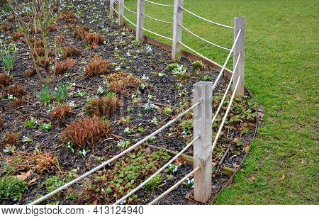 Retaining Wall At The Large Staircase In The Park The Flowerbed Area Is Planted With Rich Greenery O