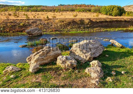 Limestones Rocks On The River Shore . Idyllic Summer Riverside Nature