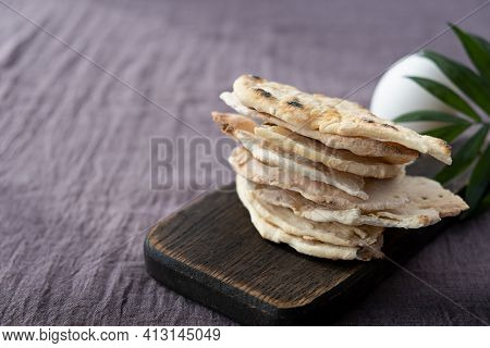 Homemade Matzo  With Microgreen Peas. Unleavened Flatbread Bread. Pesah Celebration Concept.  Jewish