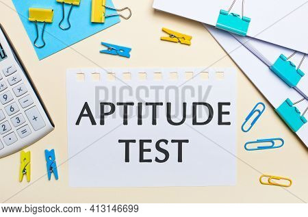 On A Light Background, There Are Stacks Of Documents, A White Calculator, Yellow And Blue Paper Clip