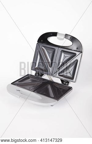 Sandwich Maker Gray With Food; Photo On White Background.