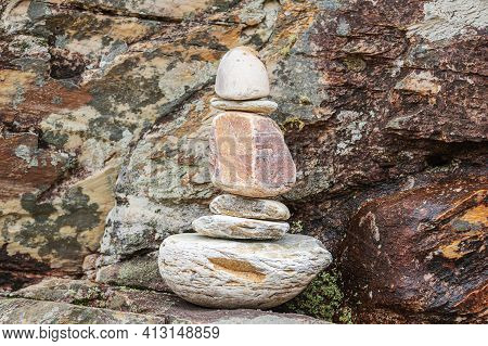 Stones stacked in a phallic shape. Concept of hard like a stone.